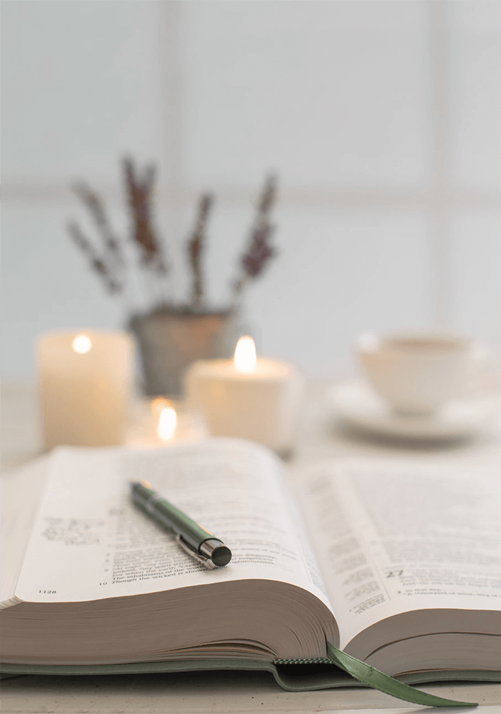 Images of Bible with pen for notes, candles and coffee symbolizing divorce recovery program